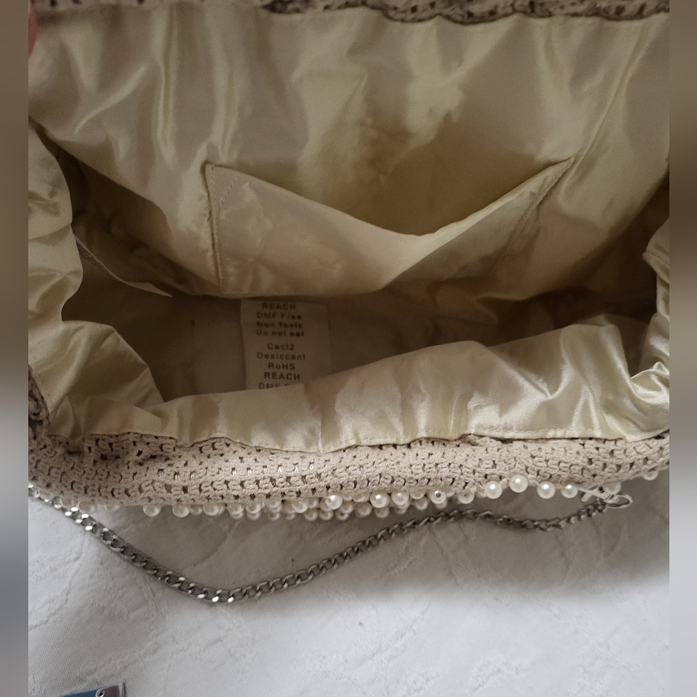 Elegant Cream Beaded Clutch with Curved Frame - Picture 15 of 15